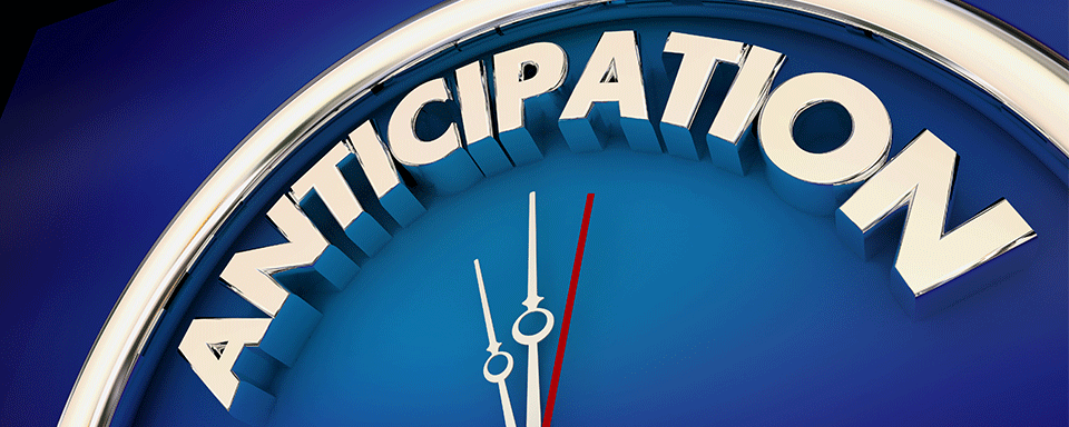 Large blue clock with the word anticipation across the top